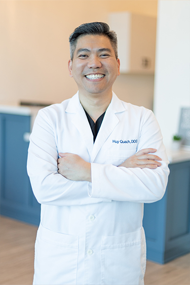 Cinco Ranch Texas dentist Huy Quach D D S with young dental patient