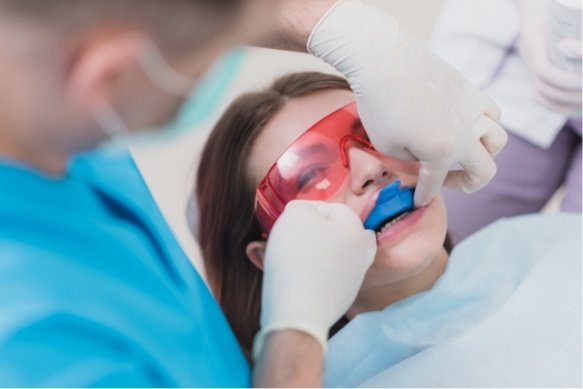 Dental patient receiving fluoride treatment