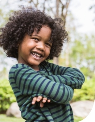 Child with healthy smile after children's dentistry